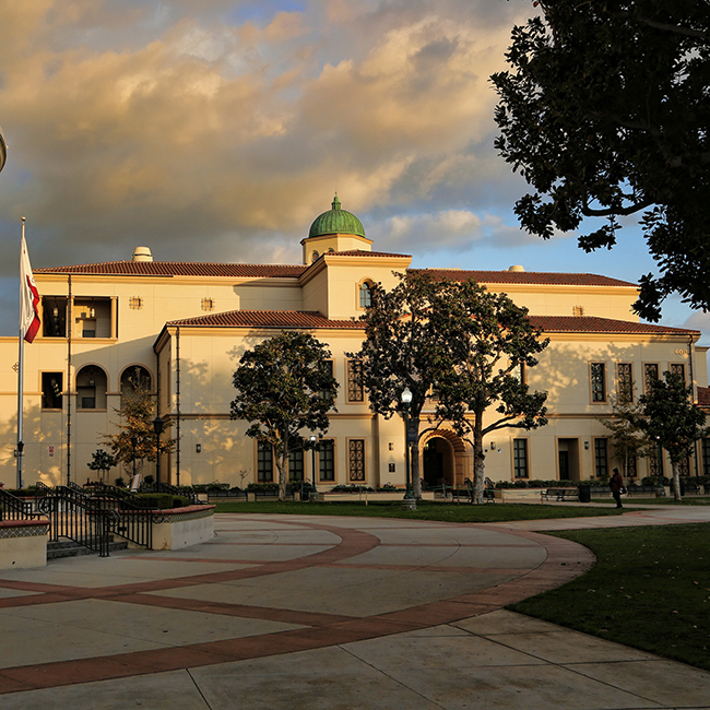 Sunset casts an orange glow on Fullerton College's Science Building at sunset.