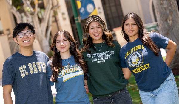 Students with apparel of universities they are transferring to